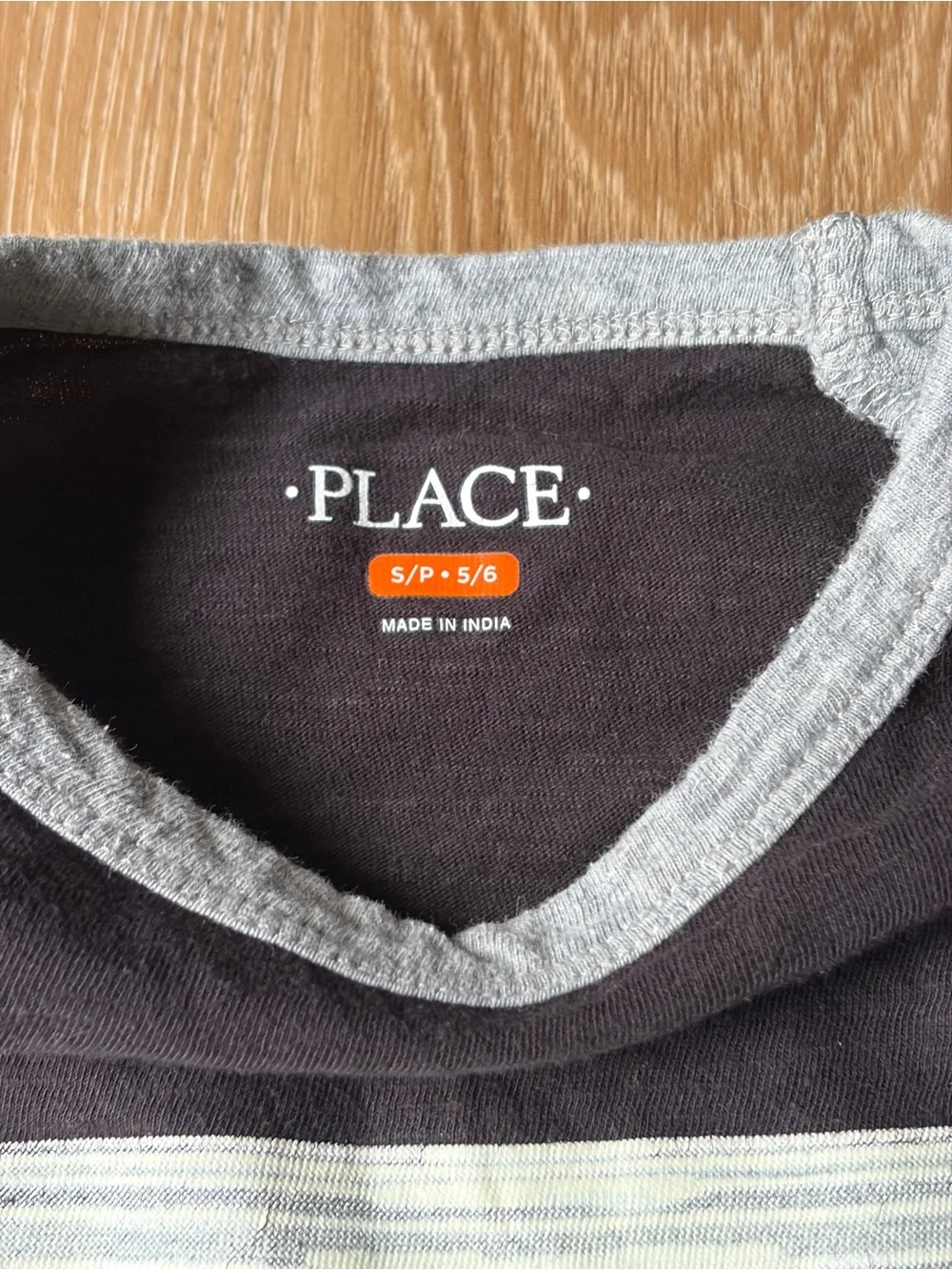 The Children’s Place Football Black Tee with Gray Neckline and Sleeves, size 5/6